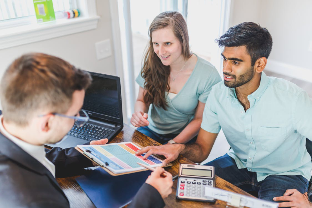 A couple is discussing finances with a professional